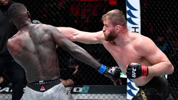 Mar 6, 2021; Las Vegas, NV, USA; Jan Blachowicz of Poland punches Israel Adesanya of Nigeria in their UFC light heavyweight championship fight during the UFC 259 event at UFC APEX on March 06, 2021 in Las Vegas, Nevada.