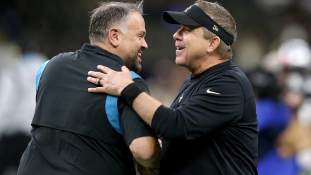 Matt Rhule and Sean Payton embrace after a game.