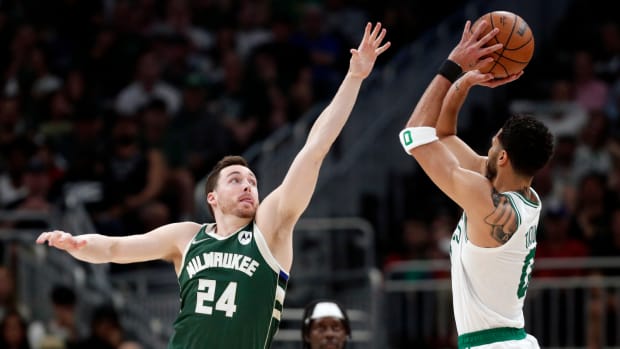 May 13, 2022; Milwaukee, Wisconsin, USA; Milwaukee Bucks guard Pat Connaughton (24) defends Boston Celtics forward Jayson Tatum (0) during the second quarter during game six of the second round for the 2022 NBA playoffs at Fiserv Forum.