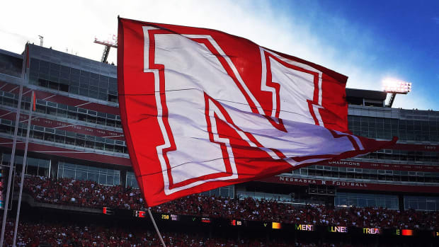 A Nebraska Cornhuskers flag is waved in the end zone after a Nebraska touchdown during their game at Memorial Stadium Stadium at the University of Nebraska