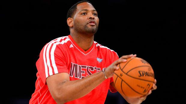 NBA former player Robert Horry shoots during the 2013 NBA All-Star shooting stars competition at the Toyota Center.