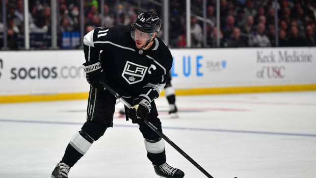 May 12, 2022; Los Angeles, California, USA; Los Angeles Kings center Anze Kopitar (11) controls the puck against the Edmonton Oilers during the second period in game six of the first round of the 2022 Stanley Cup Playoffs at Crypto.com Arena. Mandatory Credit: Gary A. Vasquez-USA TODAY Sports