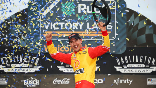 Joey Logano celebrates in victory lane after winning the NASCAR Cup Series Goodyear 400 at Darlington Raceway on May 08. (Photo by James Gilbert/Getty Images)