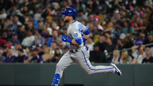 May 13, 2022; Denver, Colorado, USA; Kansas City Royals left fielder Andrew Benintendi (16) RBI triples in the seventh inning against the Colorado Rockies at Coors Field. Mandatory Credit: Ron Chenoy-USA TODAY Sports