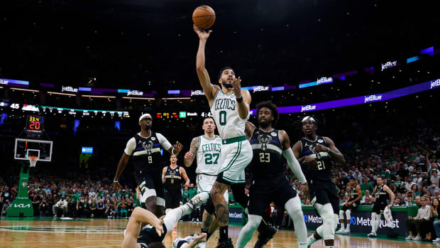 Boston Celtics forward Jayson Tatum (0) shoots past Milwaukee Bucks guard Wesley Matthews (23) during the second quarter of game seven of the second round of the 2022 NBA playoffs at TD Garden.