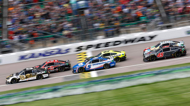 In some early-race action during Sunday's NASCAR Cup Advent Health 400 at Kansas Speedway, Tyler Reddick, Christopher Bell, Kyle Larson, Austin Cindric, eventual winner Kurt Busch, and younger brother Kyle Busch mix it up. (Photo by Chris Graythen/Getty Images)