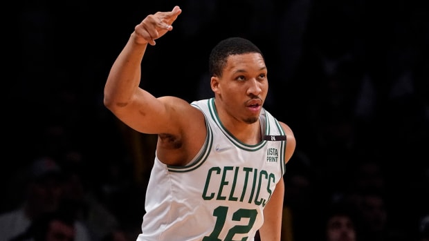 Celtics forward Grant Williams (12) reacts after scoring three points during the first half of Game 4 of an NBA basketball first-round playoff series against the Brooklyn Nets, Monday, April 25, 2022, in New York.