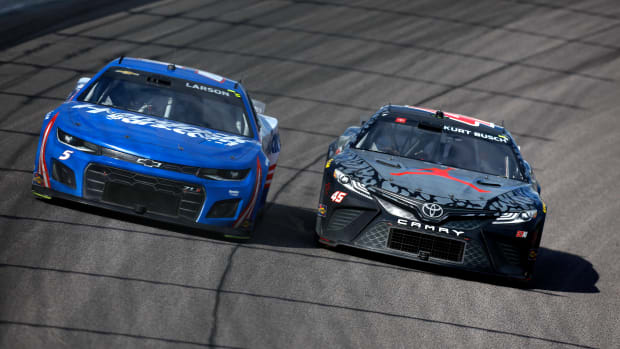 Kurt Busch (right) passes Austin Cindric en route to Sunday win in the AdventHealth 400 NASCAR Cup race at Kansas Speedway. (Photo by Sean Gardner/Getty Images)