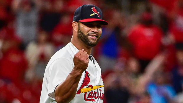 St. Louis Cardinals relief pitcher Albert Pujols (5) reacts after the final out in the ninth inning against the San Francisco Giants at Busch Stadium.