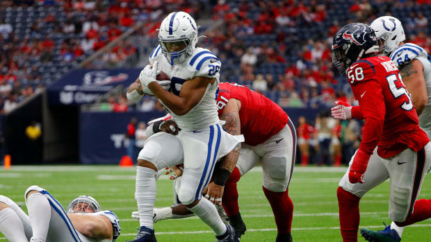 Indianapolis Colts running back Jonathan Taylor (28) runs the ball during the first quarter of the game Sunday, Dec. 5, 2021, at NRG Stadium in Houston. Indianapolis Colts Versus Houston Texans On Sunday Dec 5 2021 At Nrg Stadium In Houston Texas