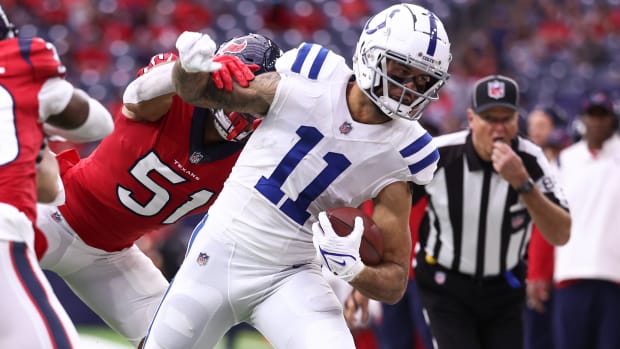 Dec 5, 2021; Houston, Texas, USA; Indianapolis Colts wide receiver Michael Pittman (11) makes a reception as Houston Texans outside linebacker Kamu Grugier-Hill (51) defends during the first quarter at NRG Stadium. Mandatory Credit: Troy Taormina-USA TODAY Sports