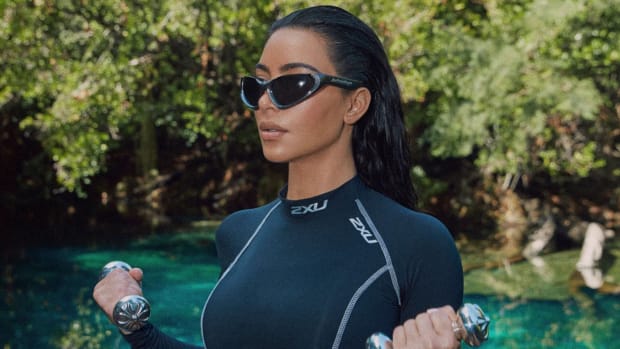 Kim Kardashian poses for an SI Swim shoot