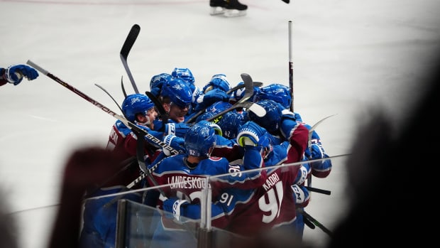 May 17, 2022; Denver, Colorado, USA; Members of the Colorado Avalanche celebrate an overtime win against the St. Louis Blues in game one of the second round of the 2022 Stanley Cup Playoffs at Ball Arena.