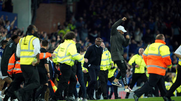 Crystal Palace manager Patrick Vieira pictured (center) at Goodison Park before thousands of Everton fans rushed the field after their side's 3-2 win in May 2022