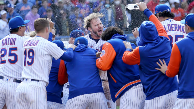 May 19, 2022; New York City, New York, USA; New York Mets first baseman Pete Alonso (20) celebrates with teammates as he steps on home plate after hitting a game winning two run home run against the St. Louis Cardinals during the tenth inning at Citi Field.