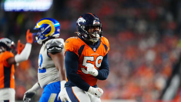 Denver Broncos linebacker Malik Reed (59) celebrates after making atackle against the Los Angeles Rams in the second quarter at Empower Field at Mile High.