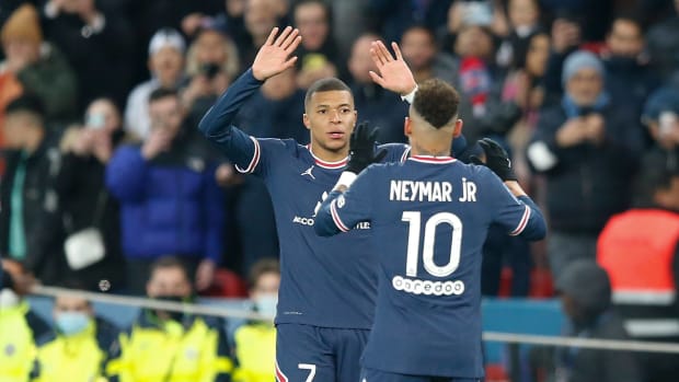 Kylian Mbappe pictured (left) celebrating a goal for PSG with teammate Neymar in April 2022