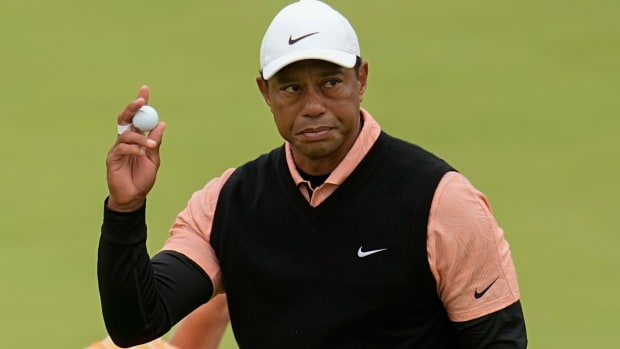 Tiger Woods waves after making a putt on the 18th hole during the third round of the PGA Championship golf tournament at Southern Hills Country Club, Saturday, May 21, 2022, in Tulsa, Okla. (AP Photo/Sue Ogrocki)