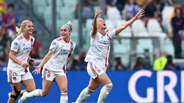 Amandine Henry pictured (right) celebrating after scoring a wonder goal for Lyon in the 2022 Women's Champions League final against Barcelona