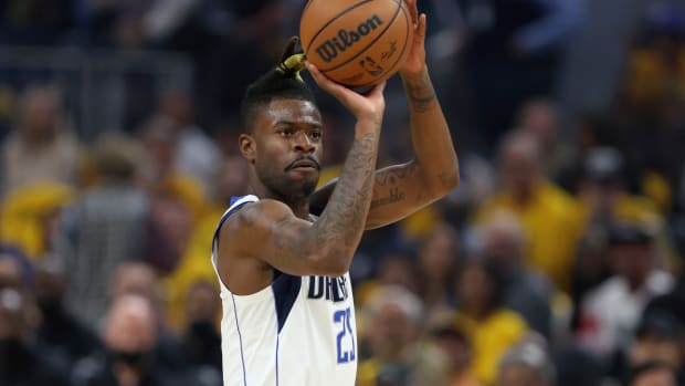 Dallas Mavericks forward Reggie Bullock shoots against the Golden State Warriors during the first half of Game 1 of the NBA basketball playoffs Western Conference finals in San Francisco, Wednesday, May 18, 2022. (AP Photo/Jed Jacobsohn)