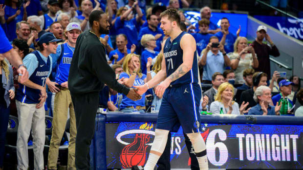 May 8, 2022; Dallas, Texas, USA; Dallas Mavericks guard Theo Pinson (1) greets guard Luka Doncic (77) as Doncic comes out of the game against the Phoenix Suns during the fourth quarter during game four of the second round for the 2022 NBA playoffs at American Airlines Center.