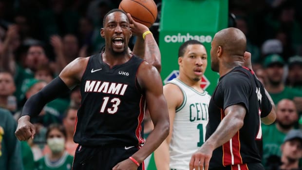 Miami Heat’s Bam Adebayo (13) celebrates after scoring against the Boston Celtics during the second half of Game 3 of the NBA basketball playoffs Eastern Conference finals Saturday, May 21, 2022, in Boston.