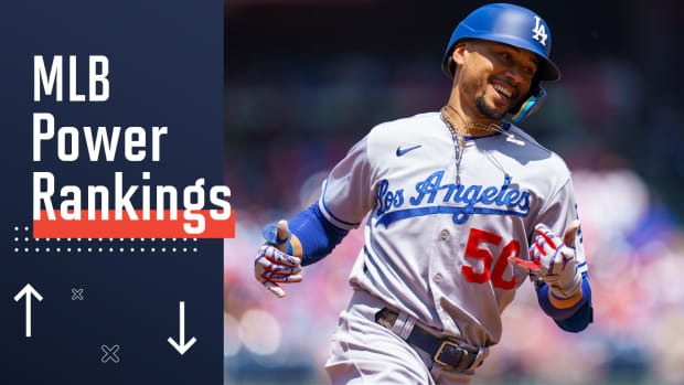 Los Angeles Dodgers’ Mookie Betts reacts after his solo home run during the third inning of a baseball game against the Philadelphia Phillies, Sunday, May 22, 2022, in Philadelphia.