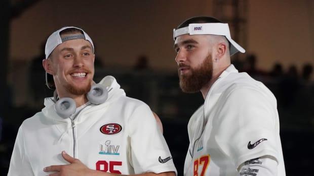 Jan 27, 2020; Miami, FL, USA; San Francisco 49ers tight end George Kittle (85) greets Kansas City Chiefs tight end Travis Kelce (87) during Super Bowl LIV Opening Night at Marlins Park. Mandatory Credit: Kirby Lee-USA TODAY Sports