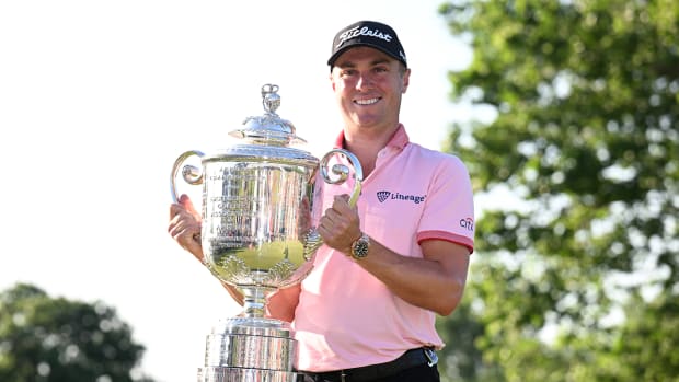 Justin Thomas poses with the Wanamaker trophy after winning the PGA Championship.