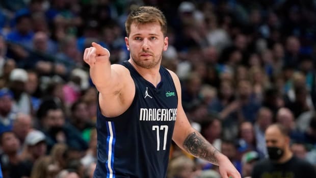 Dallas Mavericks guard Luka Doncic (77) reacts after a basket during the first half against the Golden State Warriors in Game 3 of the NBA basketball playoffs Western Conference finals, Sunday, May 22, 2022, in Dallas.