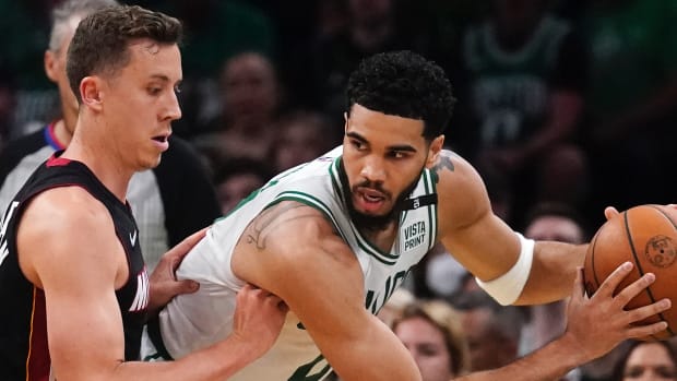 Boston Celtics forward Jayson Tatum, right, prepares to drive against Miami Heat guard Duncan Robinson, left, during the first half of Game 4 of the NBA basketball playoffs Eastern Conference finals, Monday, May 23, 2022, in Boston.