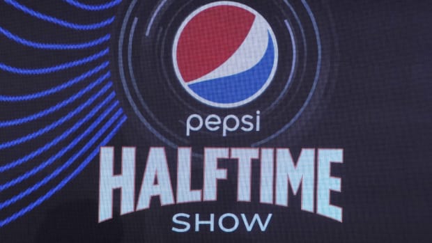 The halftime show logo is shown at the Super Bowl LVI halftime show press conference.