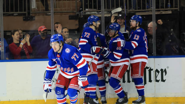 May 24, 2022; New York, New York, USA; New York Rangers center Frank Vatrano (77) celebrates his goal with center Andrew Copp (18), defenseman Adam Fox (23) and center Filip Chytil (72) during the first period against the Carolina Hurricanes in game four of the second round of the 2022 Stanley Cup Playoffs at Madison Square Garden.