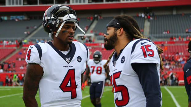 Dec 21, 2019; Tampa, Florida, USA; Houston Texans quarterback Deshaun Watson (4) and wide receiver Will Fuller (15) talk against the Tampa Bay Buccaneers prior to the game at Raymond James Stadium. Mandatory Credit: Kim Klement-USA TODAY Sports