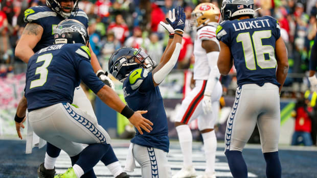 Seattle Seahawks wide receiver D'Wayne Eskridge (1) celebrates after a touchdown reception against the San Francisco 49ers during the second quarter at Lumen Field.