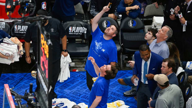Members of the arena staff put down towels to absorb water from a leaking roof before the start of the third quarter between the Dallas Mavericks and the Golden State Warriors in game four of the 2022 western conference finals at American Airlines Center.