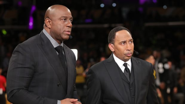 ESPN Analysts, Magic Johnson and Stephen A. Smith talk before the game between the Warriors and Lakers.
