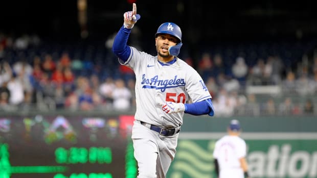 Los Angeles Dodgers’ Mookie Betts celebrates his home run during the fourth inning of a baseball game against the Washington Nationals, Tuesday, May 24, 2022, in Washington.