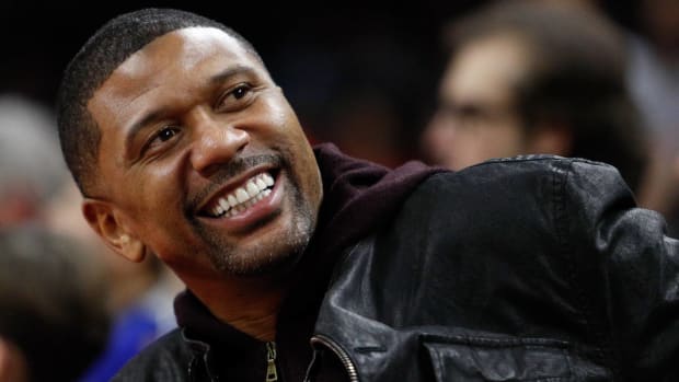 Jalen Rose on the sidelines of an NBA game.