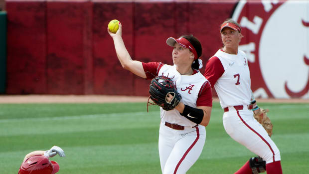 May 22, 2022; Tuscaloosa, AL, USA; Alabama second baseman Megan Bloodworth (33) completes a double play after forcing out Stanford utility player Emily Young (2). The Stanford Cardinal defeated the Alabama Crimson Tide 6-0 to claim the NCAA Tuscaloosa Regional title Sunday.