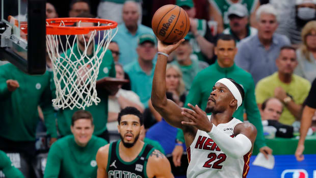 Heat’s Jimmy Butler shoots in front of Celtics’ Jayson Tatum.
