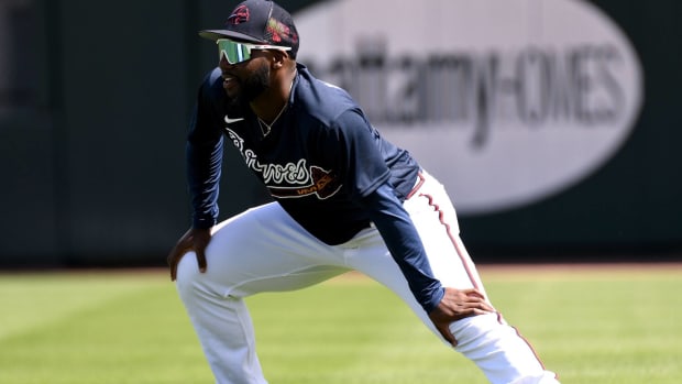 Braves prospect Michael Harris stretches before a preseason game.