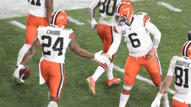 Browns running back Nick Chubb high-fives Browns quarterback Baker Mayfield after a touchdown.