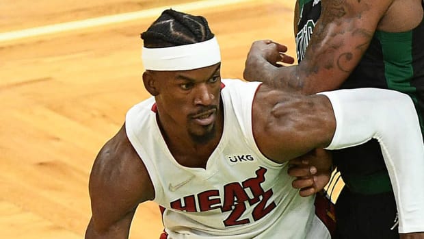 Miami Heat forward Jimmy Butler (22) moves the ball against Boston Celtics guard Marcus Smart (36) during the second half in game six of the 2022 eastern conference finals at TD Garden.
