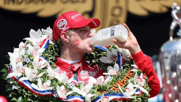 Indianapolis 500 winner Marcus Ericsson celebrates in victory lane with the traditional bottle of milk. Photo courtesy IndyCar.