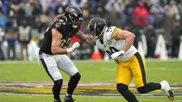 Jan 9, 2022; Baltimore, Maryland, USA; Pittsburgh Steelers linebacker T.J. Watt (90) rushes the quarterback blocked by Baltimore Ravens tight end Eric Tomlinson (85) during the second quarter at M&T Bank Stadium. Mandatory Credit: Mitch Stringer-USA TODAY Sports
