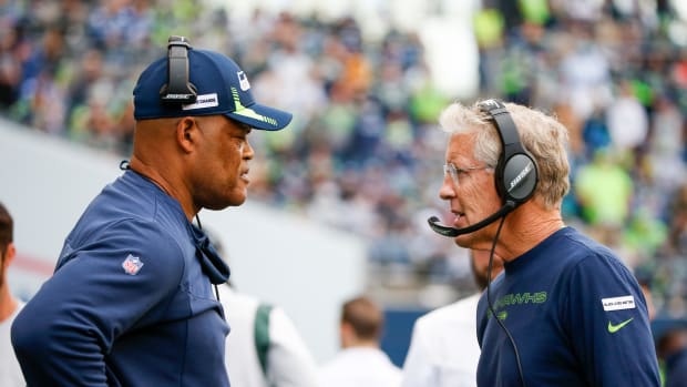 NFL: Tennessee Titans at Seattle Seahawks Sep 19, 2021; Seattle, Washington, USA; Seattle Seahawks head coach Pete Carroll, right, talks with defensive coordinator Ken Norton, Jr., left, during the fourth quarter against the Tennessee Titans at Lumen Field.