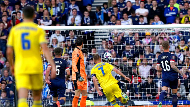 No.7 Andriy Yarmolenko watches his lobbed shot land in the net as Ukraine take the lead against Scotland in June 2022