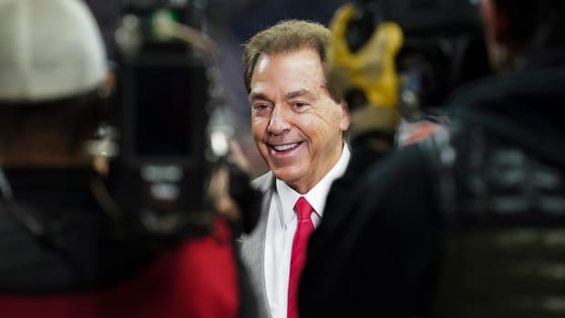 Alabama coach Nick Saban smiles during an interview with ESPN before the 2022 CFP college football national championship game.