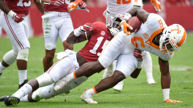 Tennessee Volunteers running back Alvin Kamara (6) carries the ball against Alabama Crimson Tide defensive back Ronnie Harrison (15) during the first quarter at Bryant-Denny Stadium in 2015.